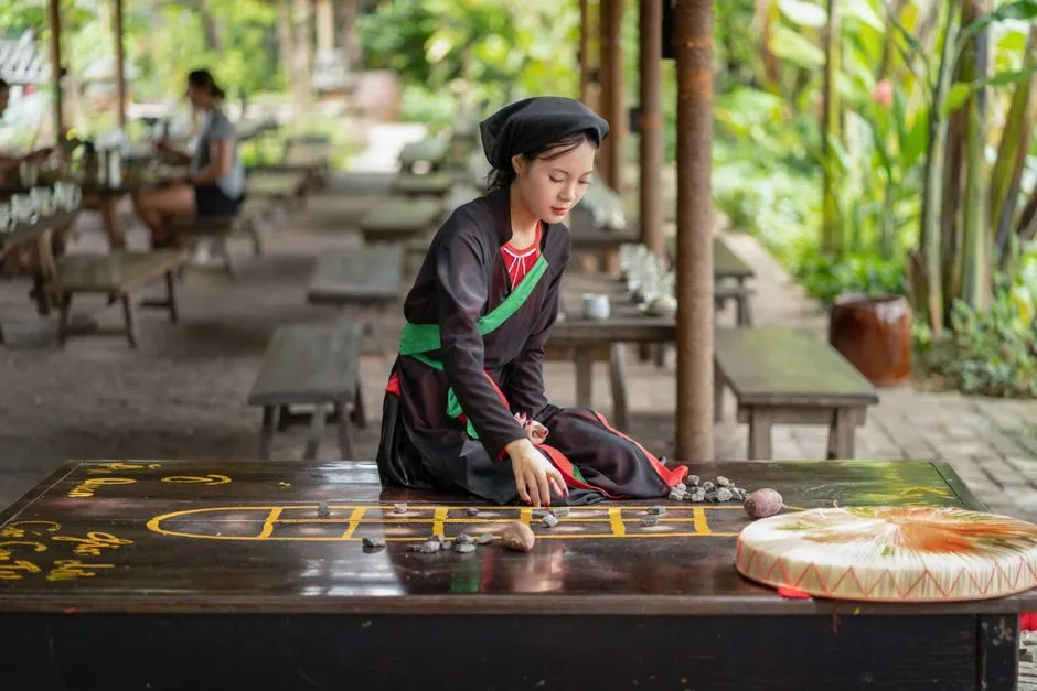Tranh minh họa trò chơi dân gian ô ăn quan